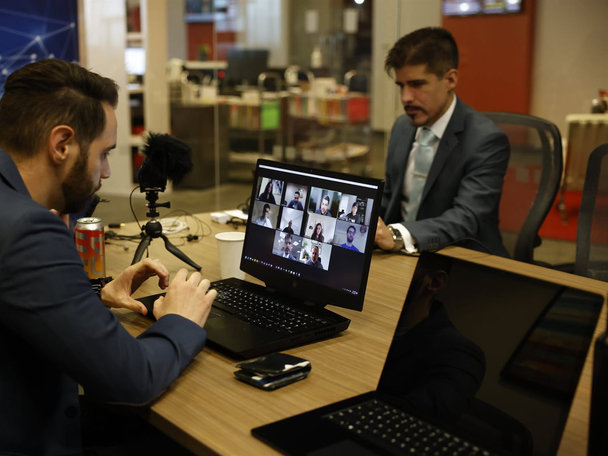 Person typing on a laptop at an office table